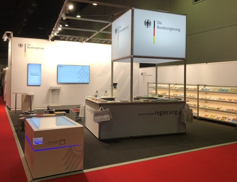 Exhibition stand of the Federal Government at the Frankfurt Book Fair 2018 with multitouch scanner table by Garamantis