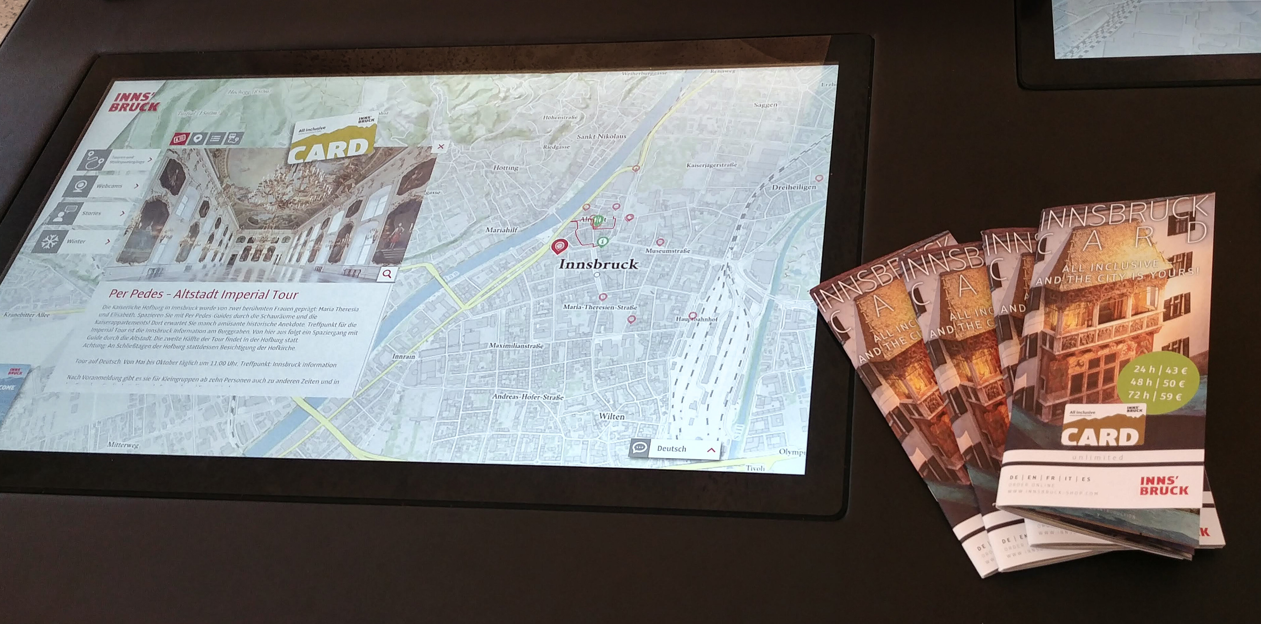 Multitouch table with interactive map and POIs in the region