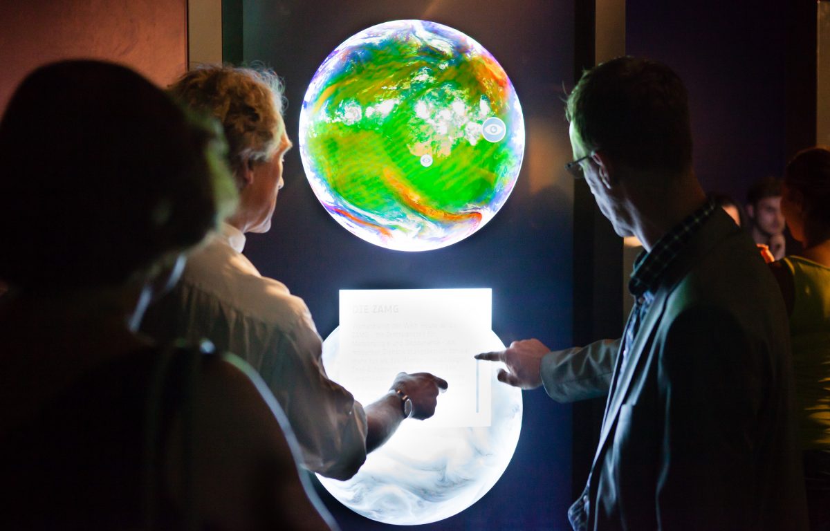 Exhibition about the ESA at the Ars Electronica Center - Visitors interact with interactive globe