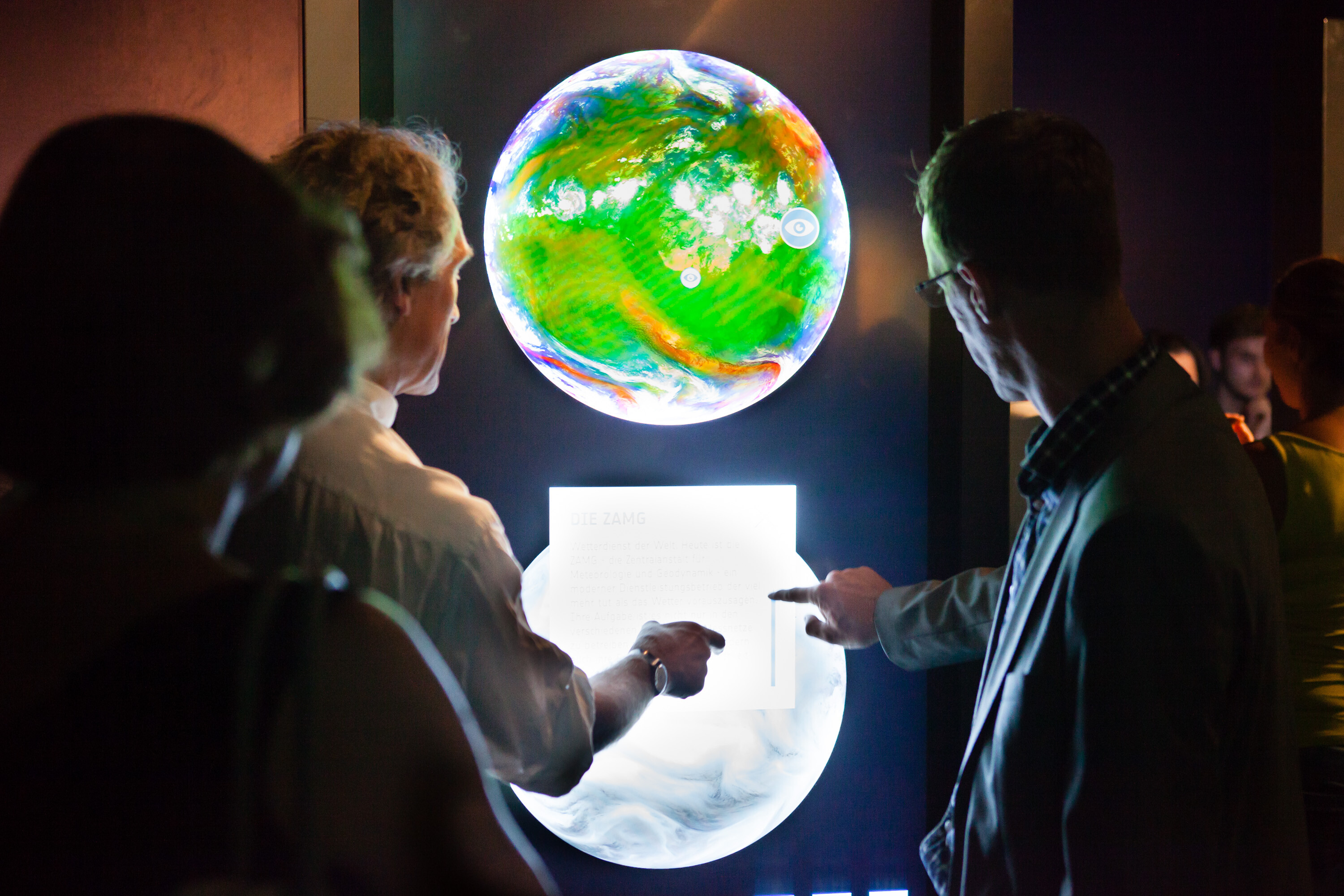 Exhibition about the ESA at the Ars Electronica Center - Visitors interact with interactive globe