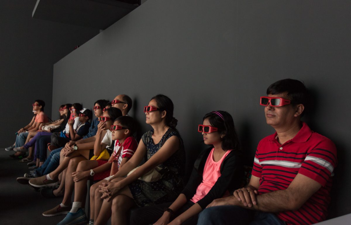 Visitors with 3D glasses in the Deep Space virtual reality environment