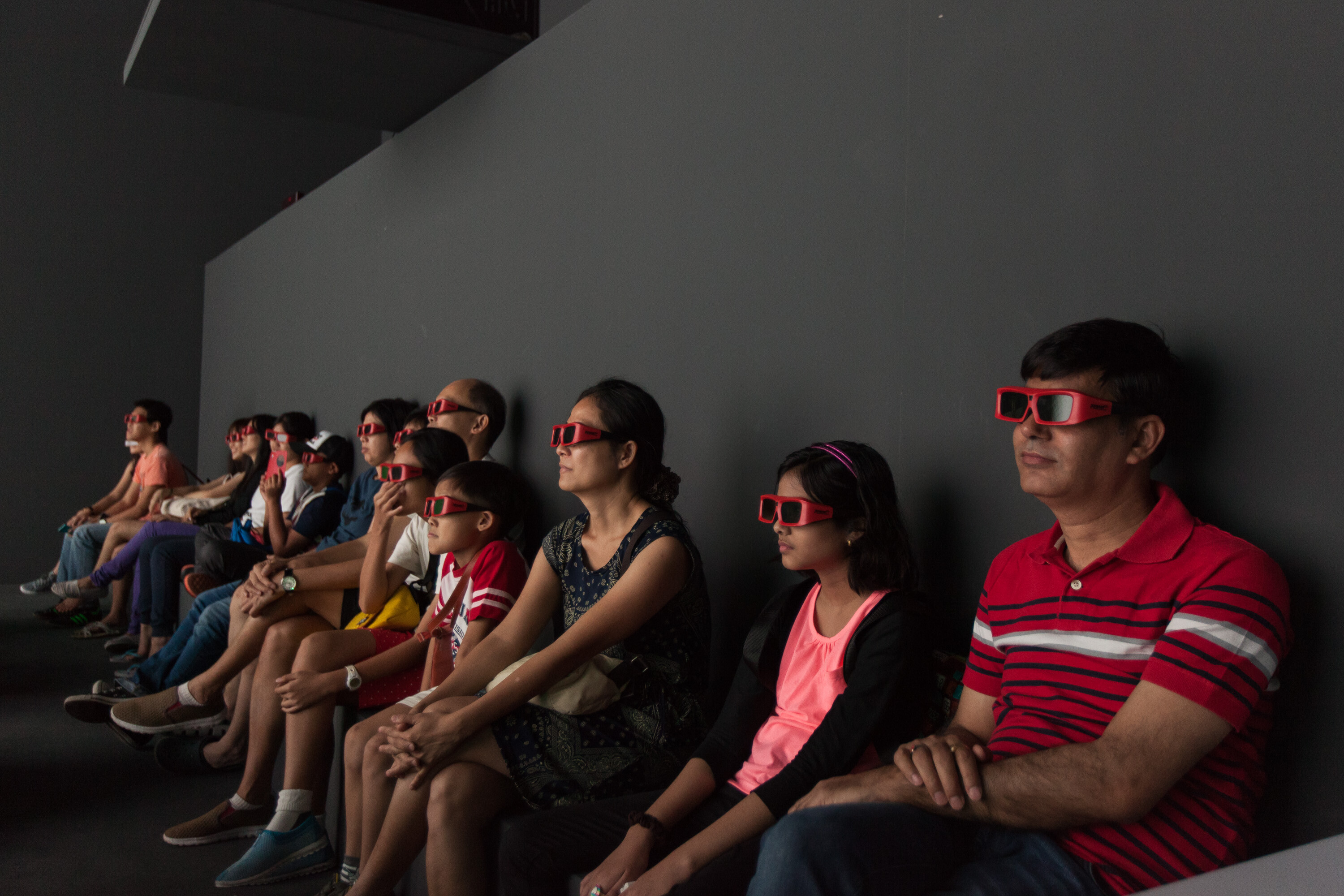 Visitors with 3D glasses in the Deep Space virtual reality environment