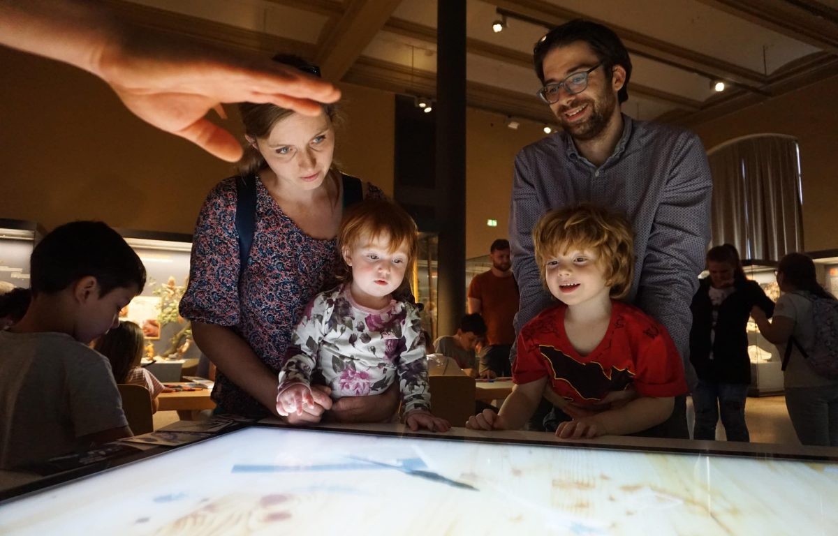 Museum visitors at the multitouch table with object recognition for the Long Night of the Museums 2017
