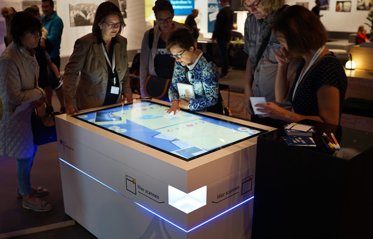 Visitors inform themselves and participate at the Federal Government's Open Day in Berlin