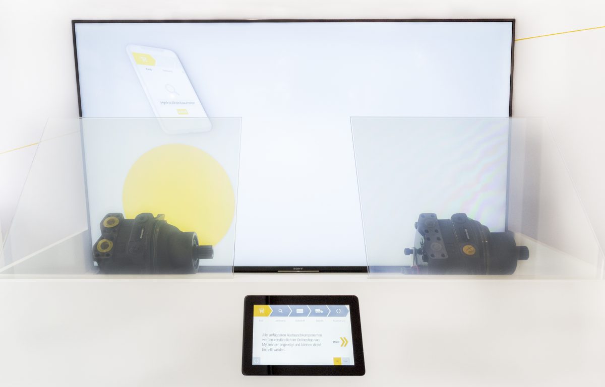 interactive showcase with touch panel and electrically switchable foil