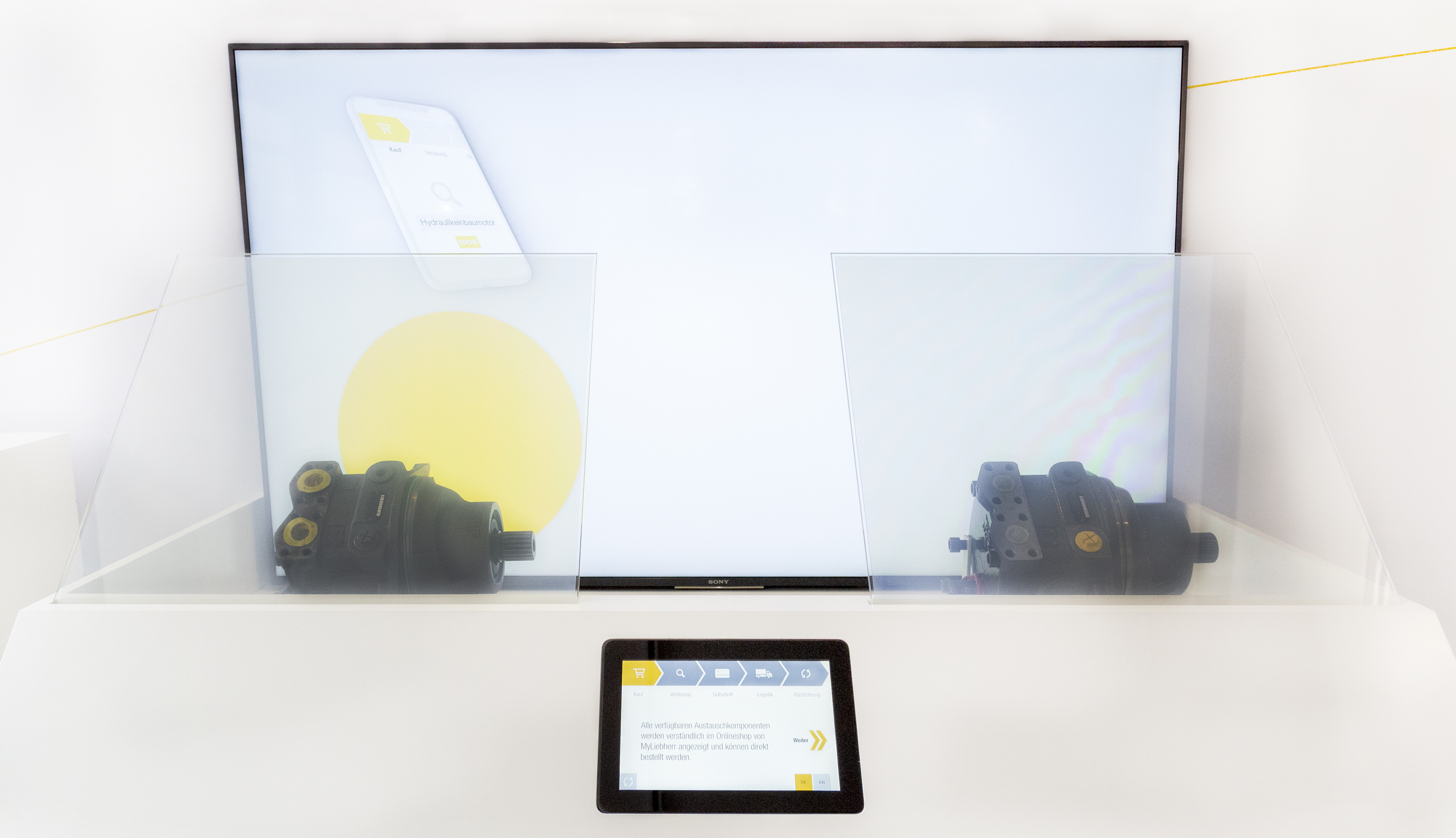 interactive showcase with touch panel and electrically switchable foil