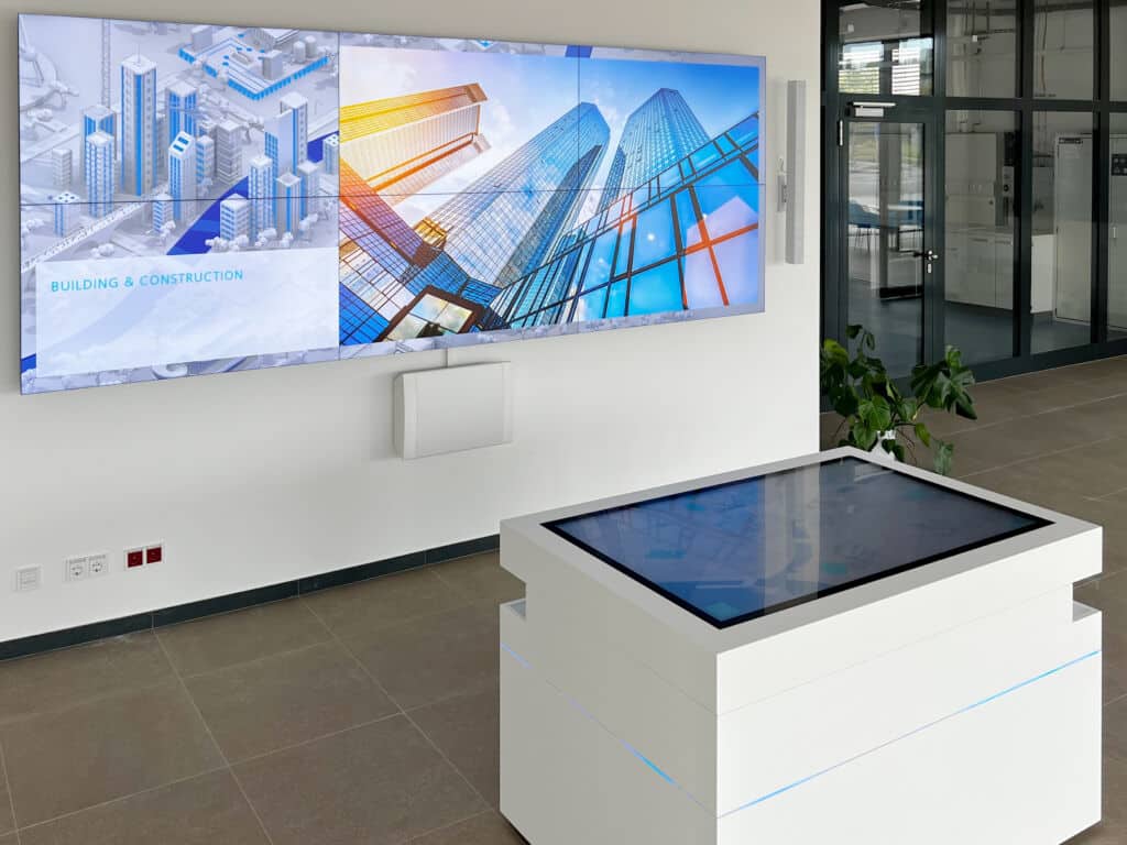 Interactive company presentations with screen wall and touch table in Daikin showroom