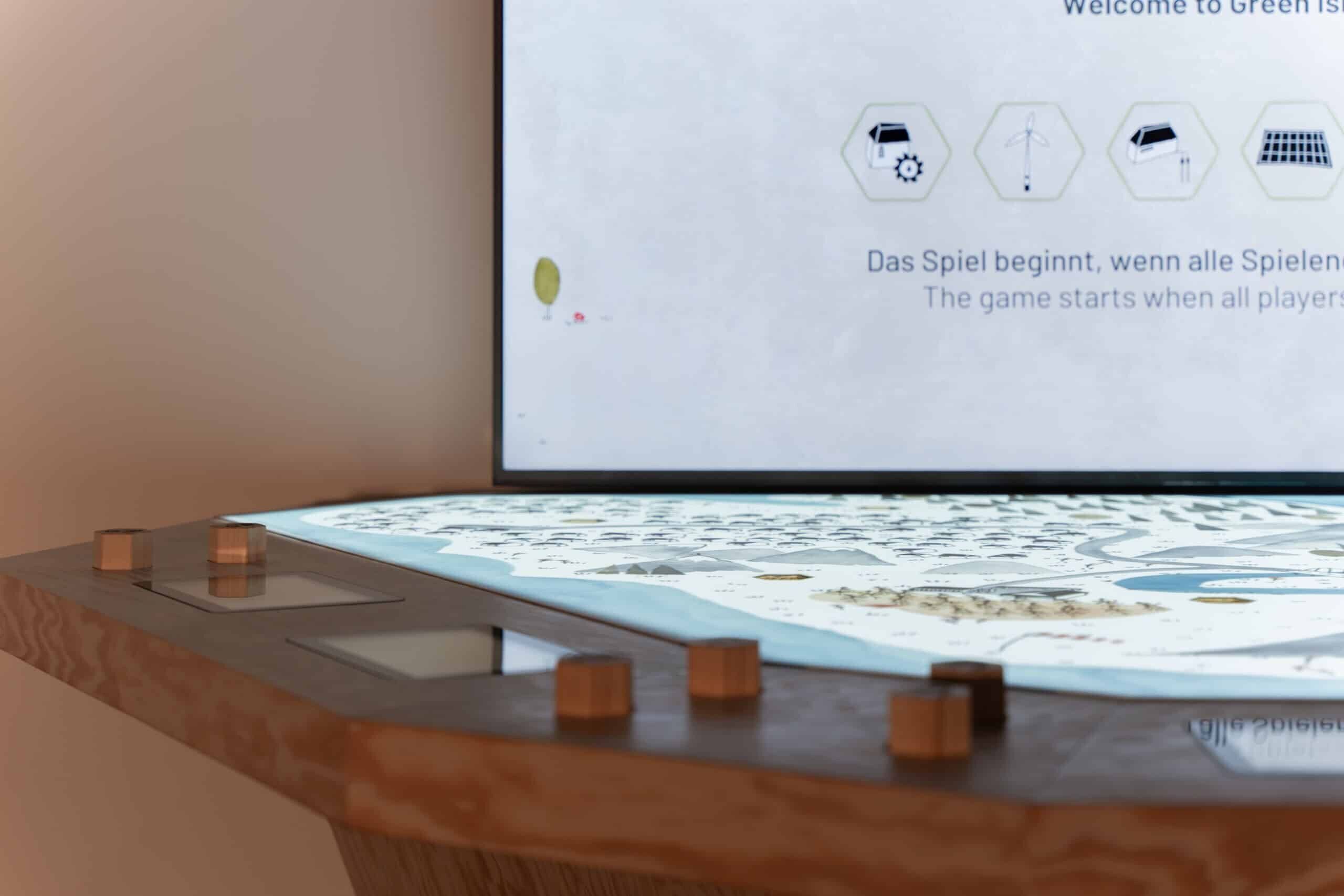 Exhibit made of wood and interactive technologies on the theme of sustainability