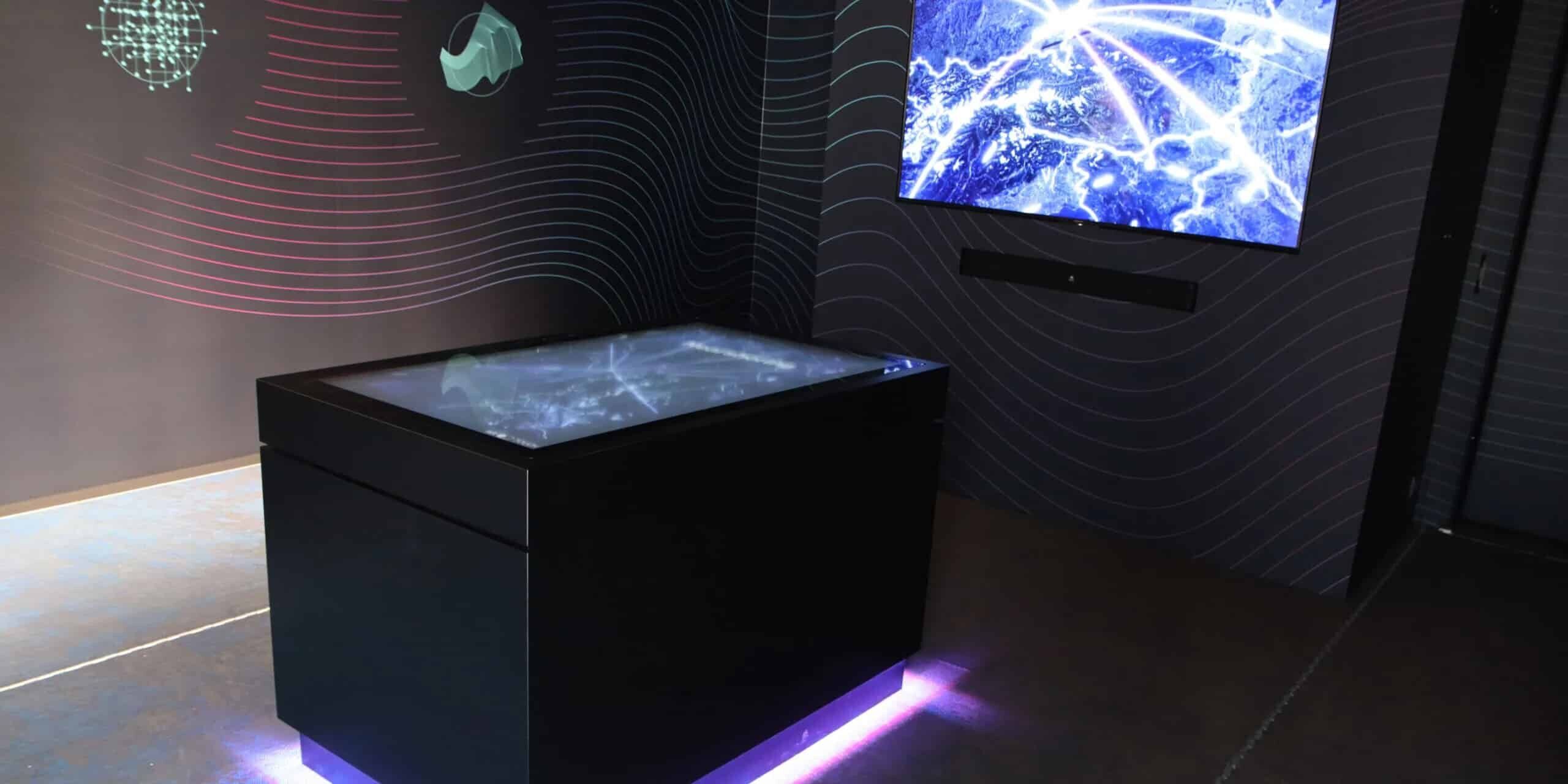 Multi-touch table with connected monitor wall in company exhibition