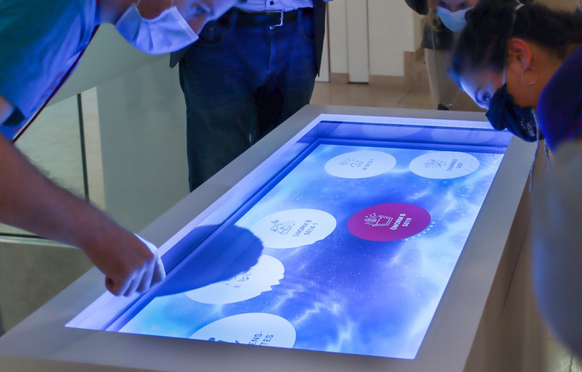 Multitouch table with water surface in the interactive exhibition