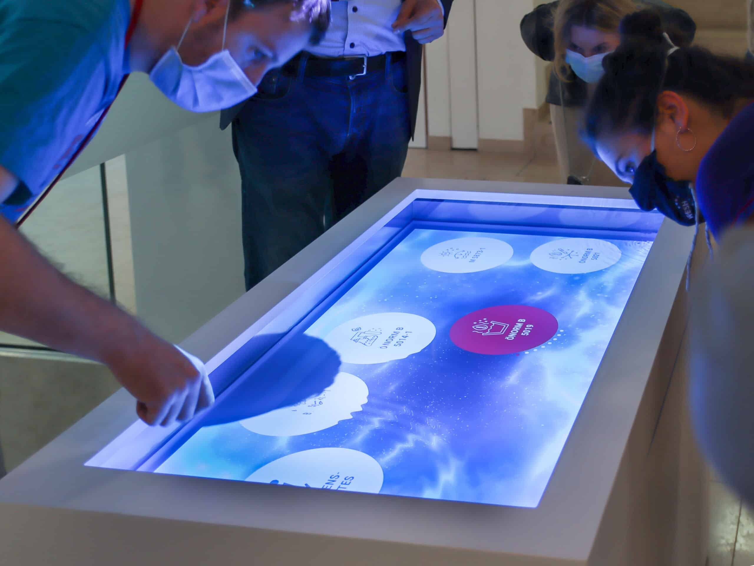 Multitouch table with water surface in the interactive exhibition